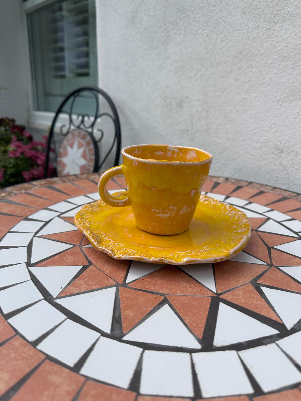 Yellow cup with a plate